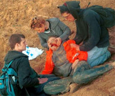 Rachel Corrie lies on the ground fatally injured by the Israeli bulldozer, Rafah, Occupied Gaza, 16 March 2003. (ISM Handout)